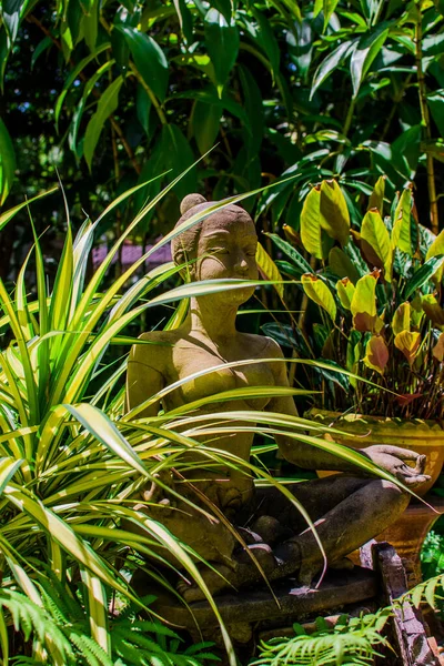 Concept tropical gardens themes and stucco of ancient Thai women. Landscape in southern Thailand.