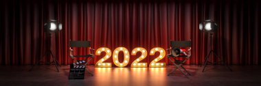 Film, sinema konsepti, tabela ışığı 2022 harf işareti. Yönetmen koltuğu ve film alkışı. 3d oluşturma