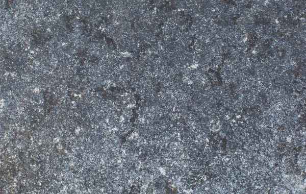Fondo de piedra oscura con salpicaduras multicolores. Textura natural — Foto de Stock