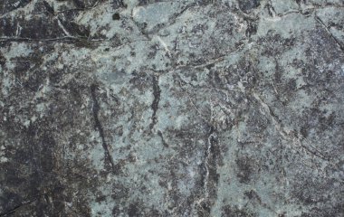 Mavi bir taşın üzerinde desen. Doğal arka plan. Taş doku