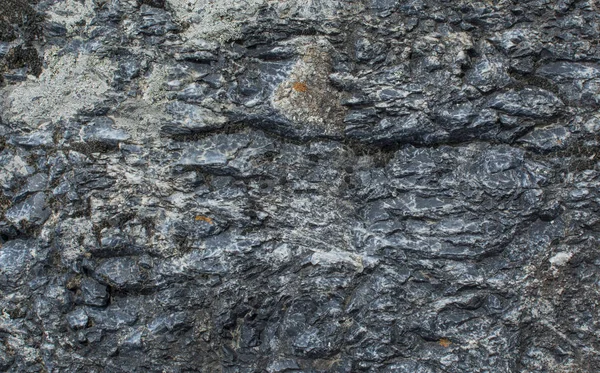 La textura de la piedra. Fondo oscuro. Patrón de alivio natural —  Fotos de Stock