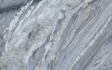 Doğal bir taş. İşlenmemiş mermer. Doku. Arka plan