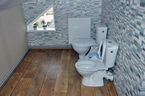 Two new ceramic toilet for children in the attic. — Stock Photo, Image