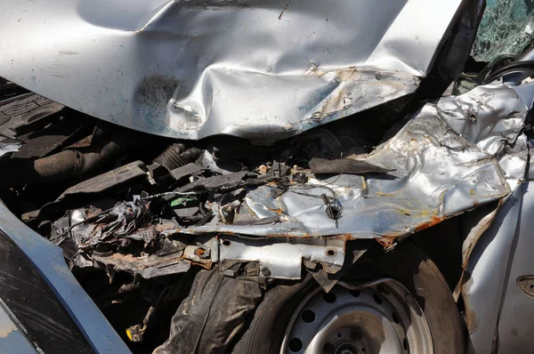 Car stands broken after avrii at the edge of the road