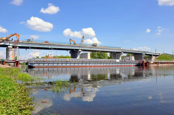 Repair of the bridge over the Pina River in Pinsk. Movement of cars in time