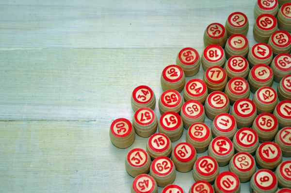 Wooden kegs, cards and chips for a game in a lotto.