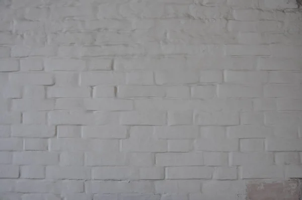 Antique white brick wall covered with paint. — Stock Photo, Image