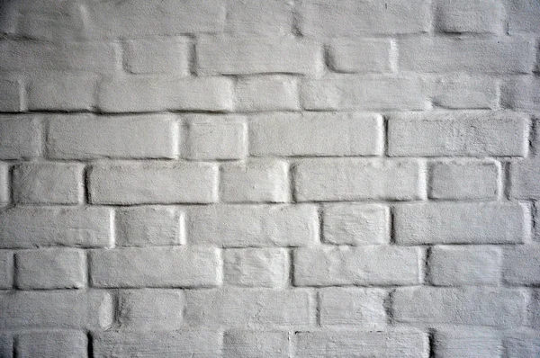 Antyczny biały mur z cegły pokryte farbą. — Zdjęcie stockowe