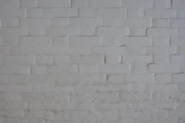 Antique white brick wall covered with paint. — Stock Photo, Image