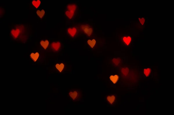 Red and orange heart bokeh background — Stock Photo, Image