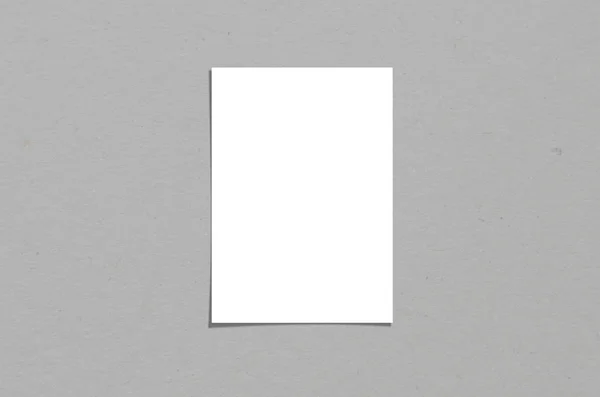 Blank white vertical paper sheet 5x7 inches with shadow overlay. Modern and stylish greeting card or wedding invitation mock up. — Stock Photo, Image