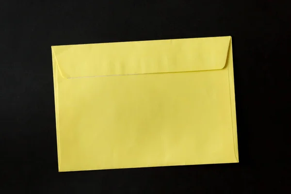 yellow envelope on black background