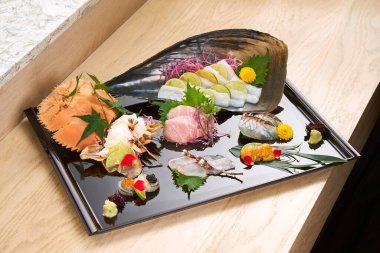 Premium Sashimi garnished with edible flowers clipart