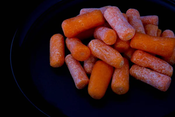 Carrots Plate Leftovers Contribute Food Wastage Image Isolated Black Background — Stock Photo, Image