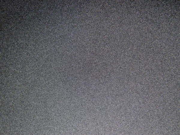 Dark gray texture in the form of a gradient. Gray background 