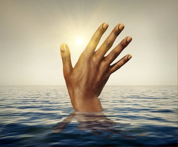 Migrant Drowning - African man hand at sea