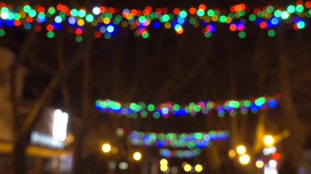 Colorful Christmas and new year lights on the street. — Stock Video