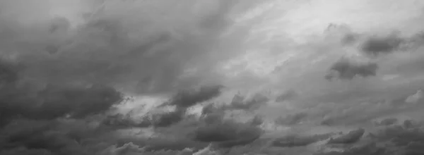 Grey overcast sky. Panorama of beautiful thunder clouds.