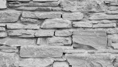 Doğal taş gri arka plan veya doku. Farklı taşlar ve beton.