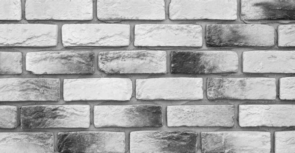 Zwart-witte bakstenen muur, zolder. Eenvoudige hoge detail bakstenen muur. Kwalitatieve achtergrond of textuur voor de beste projecten. — Stockfoto