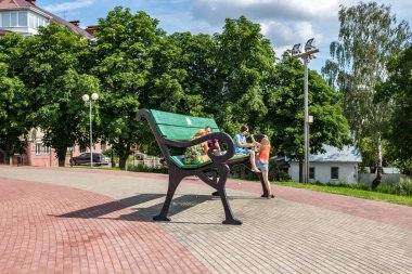 KALUGA, RUSSIA - AUGUST 2017: A huge bench in Kaluga. Park object clipart