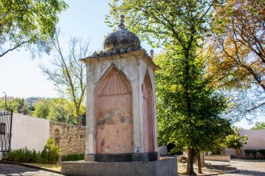 BAKHCHYSARAY, CRIMEA - SEPTEMBER 2014: The Khan's Palace or Hansaray is Bakhchysarai, Crimea. Historical and cultural reserve. Fountain in honor of the arrival of Alexander I in Bakhchisaray clipart