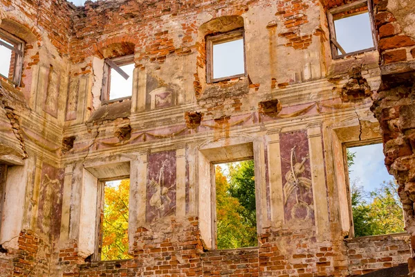 Frescoes on the walls of an old abandoned manor house of the 18th century, a view from the inside. Belkino Manor, Russia