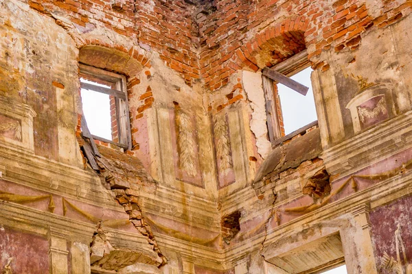 Frescoes on the walls of an old abandoned manor house of the 18th century, a view from the inside. Belkino Manor, Russia