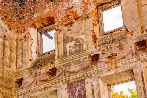 Frescoes on the walls of an old abandoned manor house of the 18th century, a view from the inside. Belkino Manor, Russia