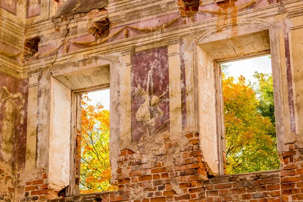 Frescoes on the walls of an old abandoned manor house of the 18th century, a view from the inside. Belkino Manor, Russia