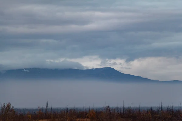 Clouds over foggy mountain landscape, September 21, 2018, Norilsk