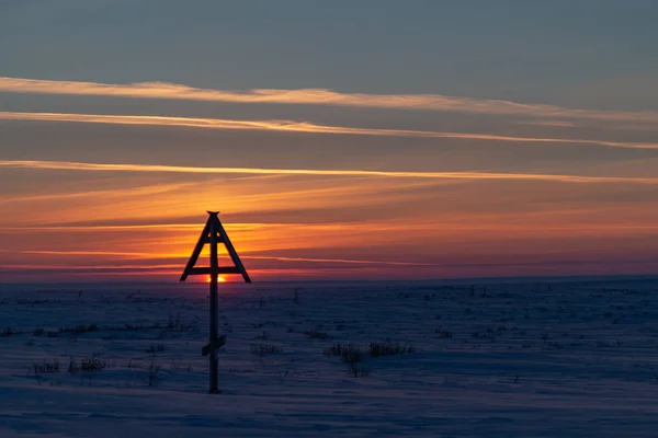 Silhouette of Cross at sunset. Norilsk Dudinka