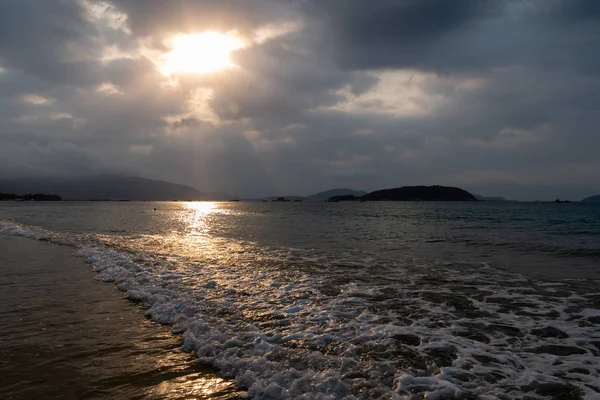 Watching sunrise at Sanya Beach, Hainan Island, China