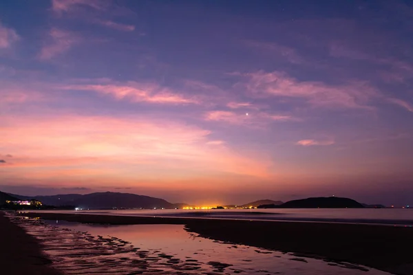 Venus in the morning sky, dawn and low tide on Hainan Island, Ch