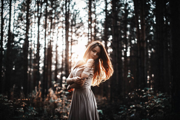 Girl in a short dress.nature, freshness, sunset