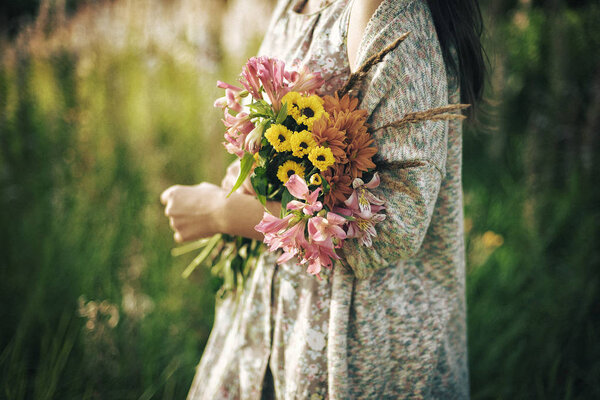 Flowers in the hands of a girl