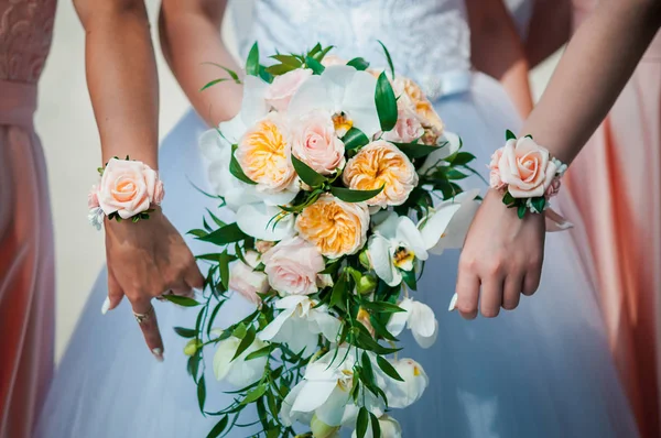 wedding bouquet in hands of bride