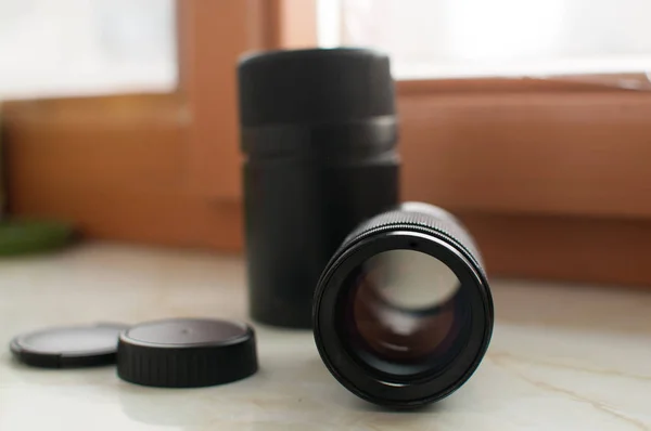 Old black manual lens with black case — Stock Photo, Image