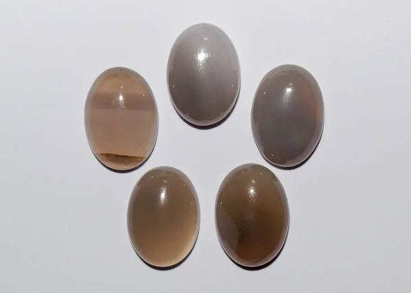 Natural oval grey agate cabochon on the white background — Stock Photo, Image