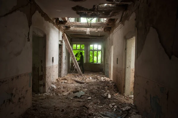 Dark shadow in the end of the hallway of abandoned hospital — Stock Photo, Image