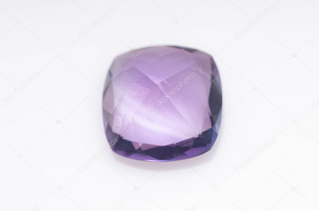 Natural violet amethyst on the white background