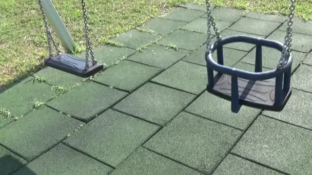 Playground Swing Wind Shakes Empty Swing — Stock Video