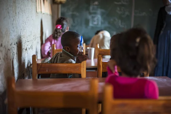 Inside the school with pupils and teacher in Khamila village, Morocco