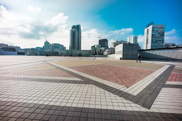 Olimpiyskiy square with paving stones and nobody on shot with big dynamic range, blue sky and colorful space