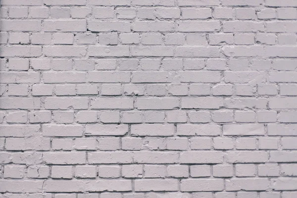 Grunge industrial grey painted brick wall background in Kyiv, Ukraine. May be used in design and interiors.