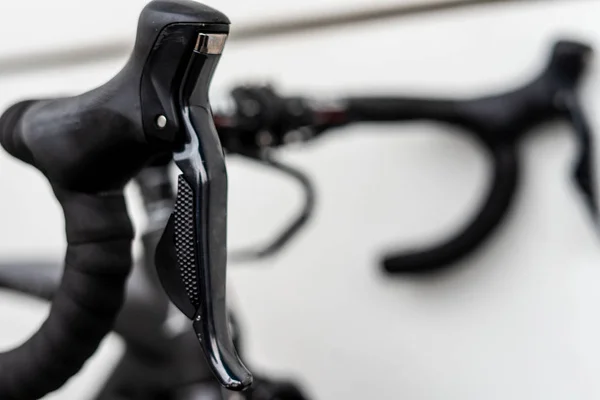 Road bike black shifterd located on bar integrated wirh brakes — Stock Photo, Image
