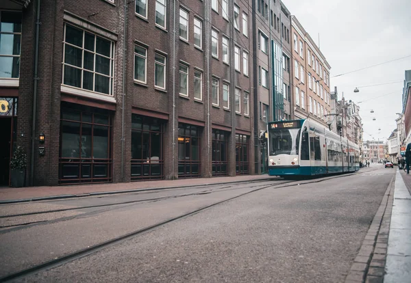 Modern public transport in Amsterdam, Netherlands. White and blu