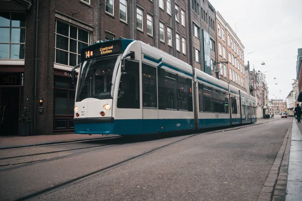 Modern public transport in Amsterdam, Netherlands. White and blu