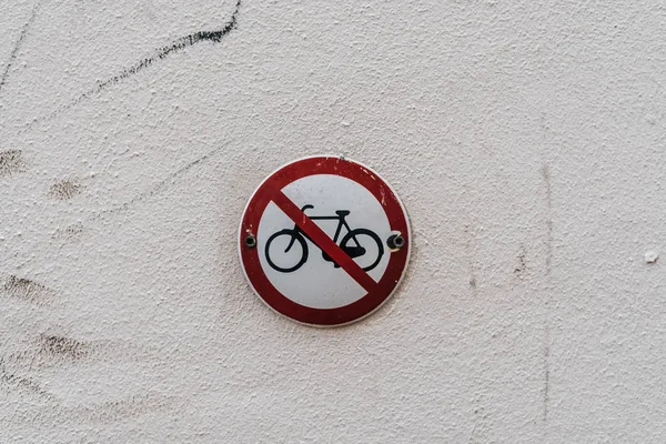 Road sign on wall. No bikes