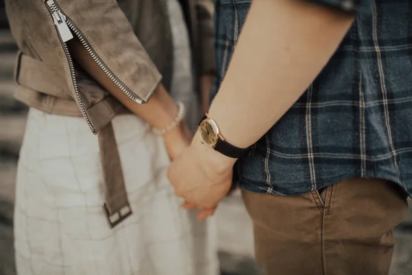 Young european couple walking in the forest and spending time together. Concept of relastionship, love and family. 
